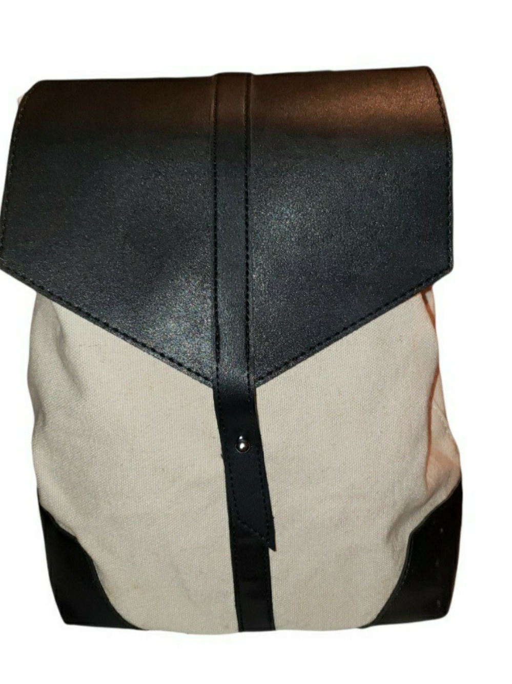 Deux Lux canvas demi backpack with a distinctive structured black vegan leather.